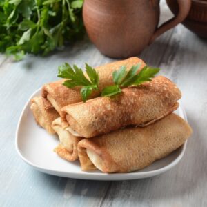 Блины фаршированные говяжьим фаршем.